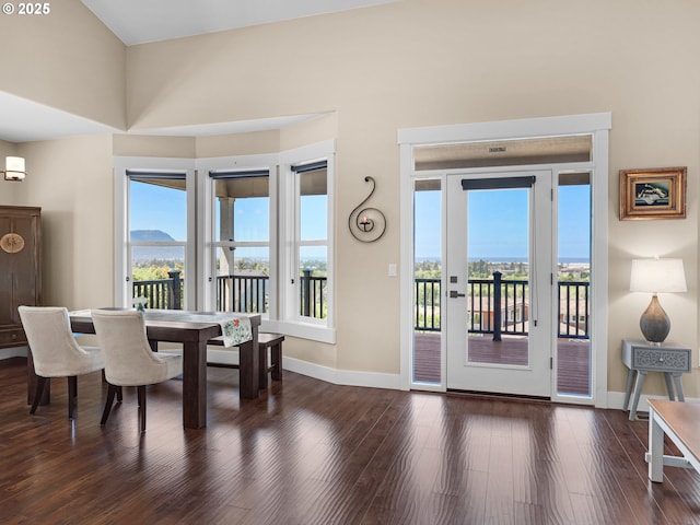 dining room with baseboards and wood finished floors