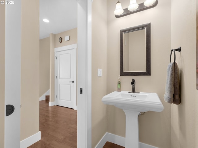 bathroom featuring baseboards and wood finished floors