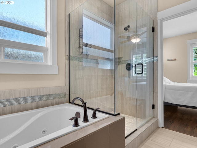 full bath featuring a jetted tub, connected bathroom, and a shower stall