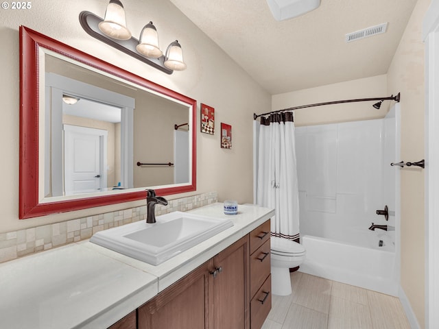 full bathroom with toilet, shower / tub combo, vanity, visible vents, and decorative backsplash