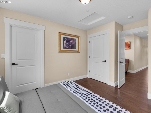 entryway with dark wood-style flooring and baseboards