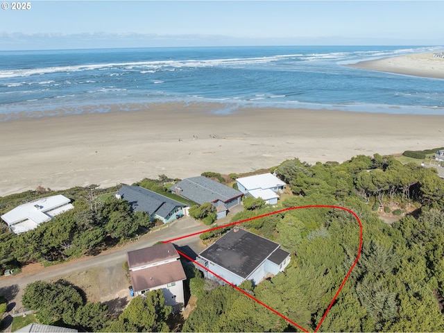 bird's eye view featuring a water view and a view of the beach