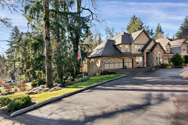 2625 Beacon Hill Dr, West Linn, OR 97068 - view of front of home with stone siding, asphalt driveway, and an attached garage