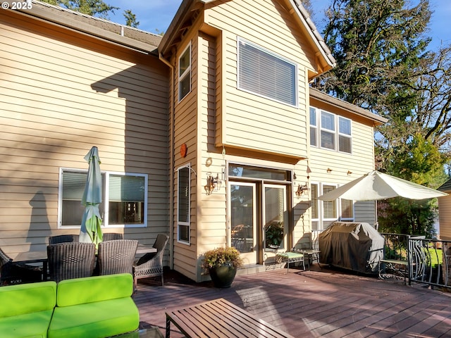 back of property featuring an outdoor hangout area and a wooden deck