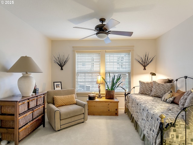 bedroom featuring ceiling fan and light colored carpet