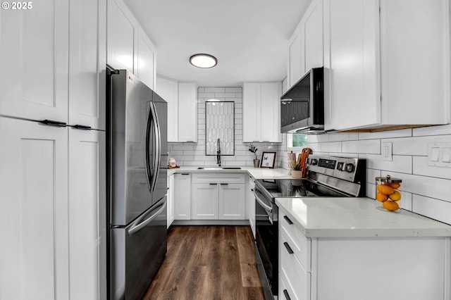 5414 SE 97th Ave, Portland, OR 97266 - kitchen with stainless steel appliances, white cabinetry, backsplash, dark wood-type flooring, and light stone countertops