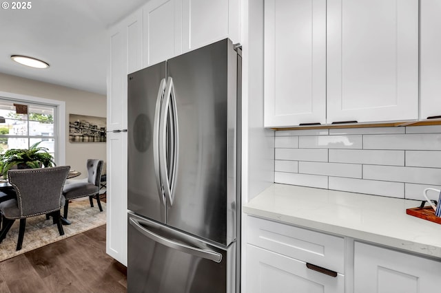 5414 SE 97th Ave, Portland, OR 97266 - kitchen with freestanding refrigerator, white cabinetry, dark wood finished floors, backsplash, and light stone countertops