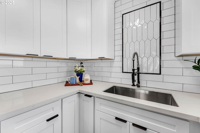 5414 SE 97th Ave, Portland, OR 97266 - kitchen with tasteful backsplash, white cabinets, and light stone counters
