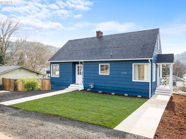 bungalow with a front yard