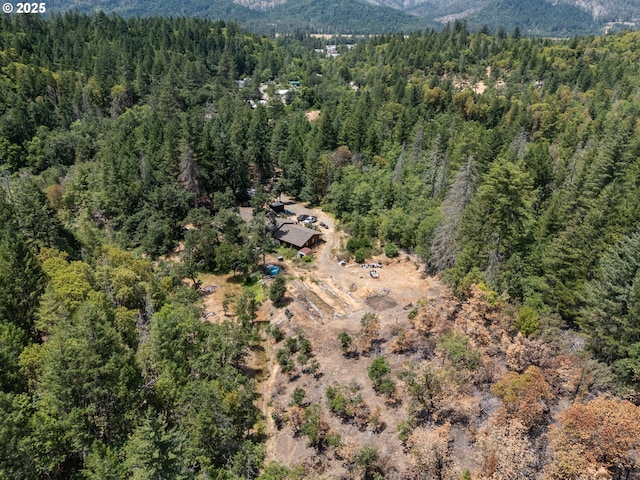 160 Holton Creek Rd, Kerby, OR 97531 - aerial overview of property's location with a heavily wooded area and a mountainous background