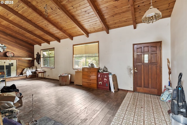 160 Holton Creek Rd, Kerby, OR 97531 - entrance foyer featuring a wood ceiling with exposed beams, hardwood / wood-style floors, a fireplace, and high vaulted ceiling