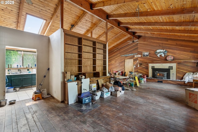 160 Holton Creek Rd, Kerby, OR 97531 - living room with wooden walls, hardwood / wood-style floors, a wood ceiling with exposed beams, built in shelves, and high vaulted ceiling
