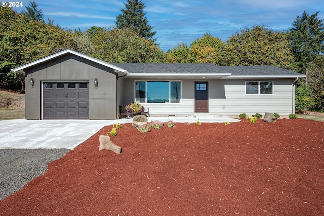 ranch-style home featuring a garage