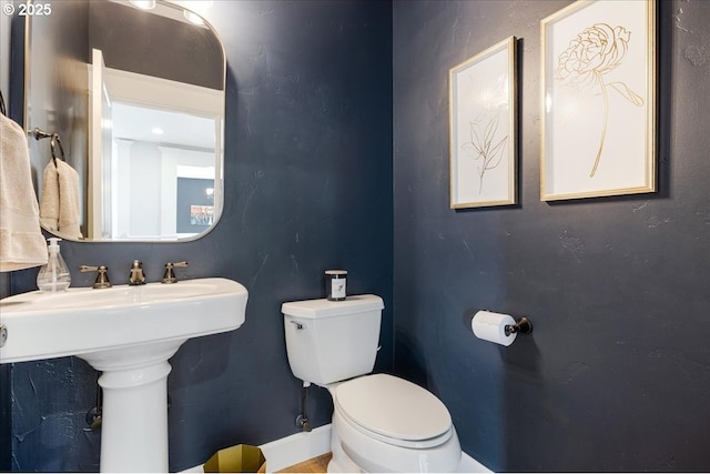 half bath featuring toilet