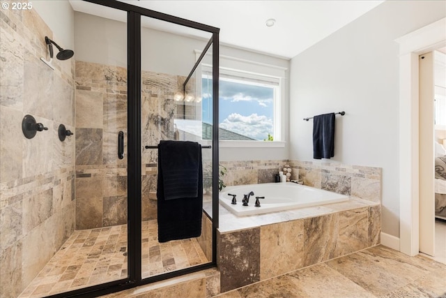bathroom featuring a garden tub and a stall shower
