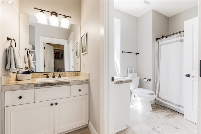 full bathroom with vanity, toilet, marble finish floor, a shower with curtain, and a spacious closet