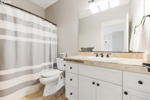 full bathroom featuring vanity and toilet