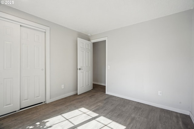 4702 NE 49th Ave, Vancouver, WA 98661 - unfurnished bedroom featuring wood finished floors, baseboards, and a closet