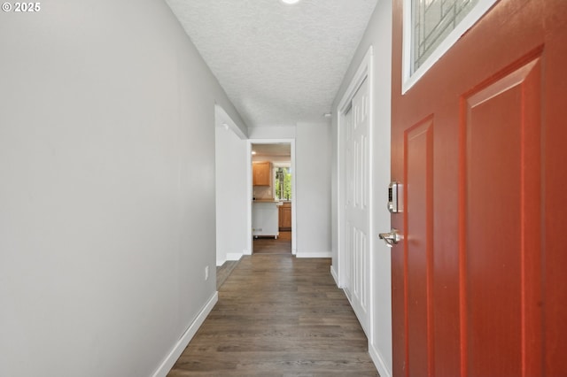 4702 NE 49th Ave, Vancouver, WA 98661 - corridor with a textured ceiling, dark wood finished floors, and baseboards