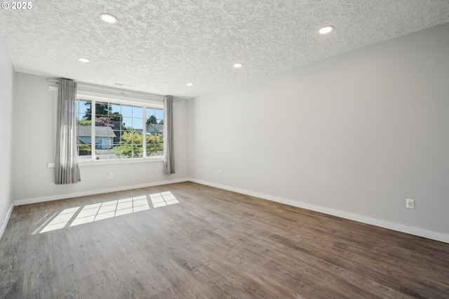 4702 NE 49th Ave, Vancouver, WA 98661 - unfurnished room featuring a textured ceiling, wood finished floors, baseboards, and recessed lighting