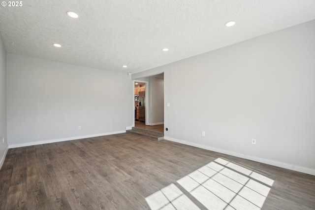 4702 NE 49th Ave, Vancouver, WA 98661 - unfurnished room with recessed lighting, baseboards, wood finished floors, and a textured ceiling