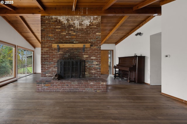 unfurnished living room with wooden ceiling, a brick fireplace, wood finished floors, and beam ceiling