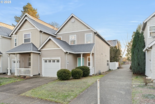 view of front of property featuring a garage and covered porch