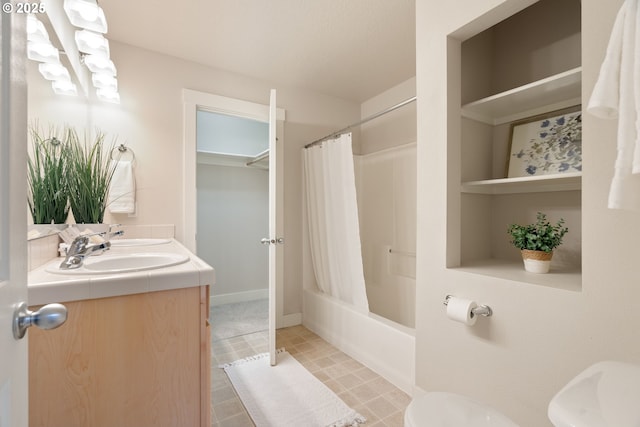 full bathroom featuring shower / tub combo with curtain, vanity, and toilet