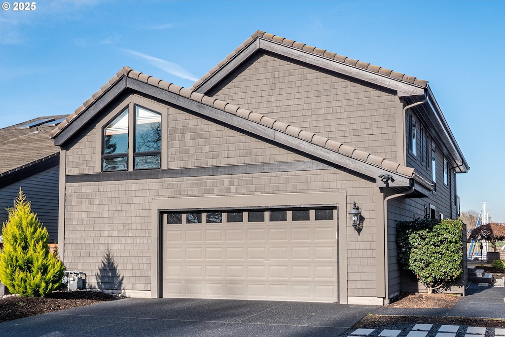 view of side of property featuring a garage