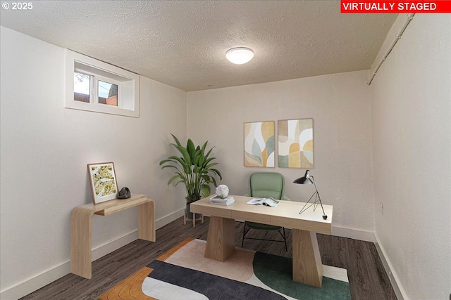 office area featuring a textured ceiling and dark hardwood / wood-style floors