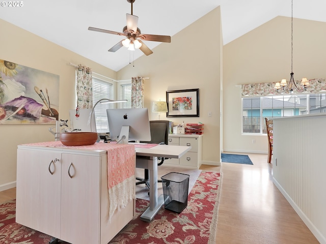 1689 Huckleberry Dr, Seaside, OR 97138 - office area with a ceiling fan, light wood-style floors, a chandelier, high vaulted ceiling, and baseboards