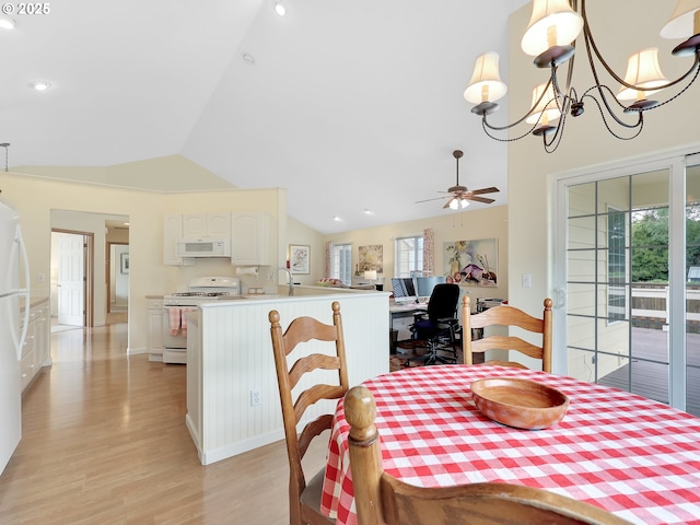 1689 Huckleberry Dr, Seaside, OR 97138 - dining room featuring light wood-style flooring, a chandelier, ceiling fan, recessed lighting, and high vaulted ceiling