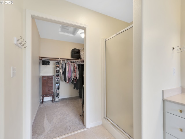 1689 Huckleberry Dr, Seaside, OR 97138 - bathroom with a stall shower, a walk in closet, vanity, and baseboards