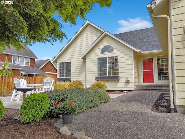 1689 Huckleberry Dr, Seaside, OR 97138 - view of front of home with a shingled roof and a patio
