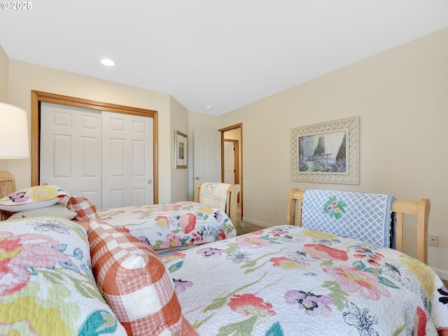 1689 Huckleberry Dr, Seaside, OR 97138 - carpeted bedroom featuring a closet, baseboards, and recessed lighting