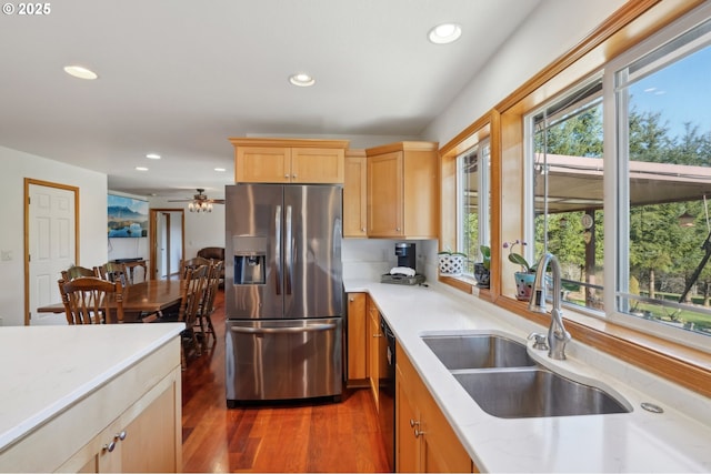 kitchen featuring dark hardwood / wood-style floors, dishwasher, sink, stainless steel refrigerator with ice dispenser, and light brown cabinets