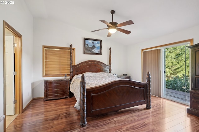 bedroom with access to exterior, hardwood / wood-style flooring, and ceiling fan