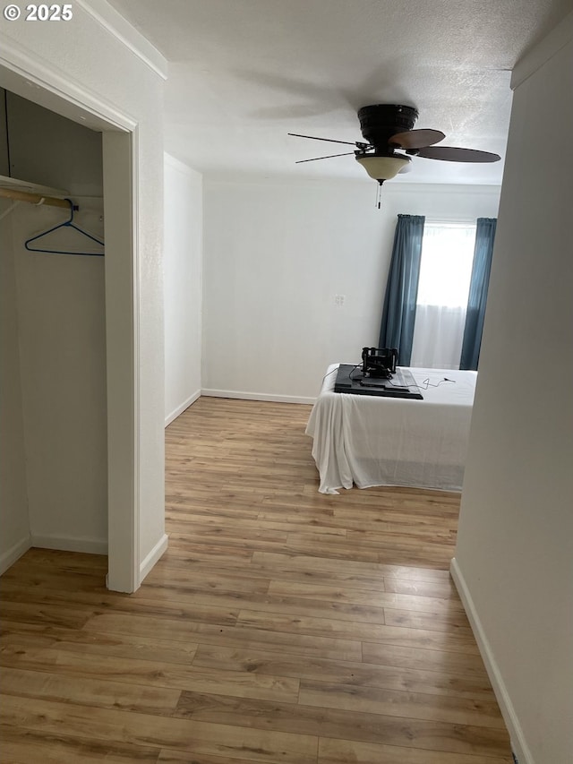 unfurnished bedroom with hardwood / wood-style flooring and ceiling fan