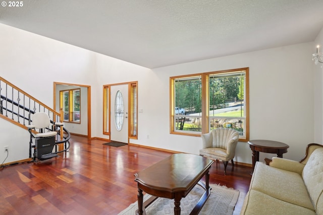 living room with hardwood / wood-style flooring and a textured ceiling