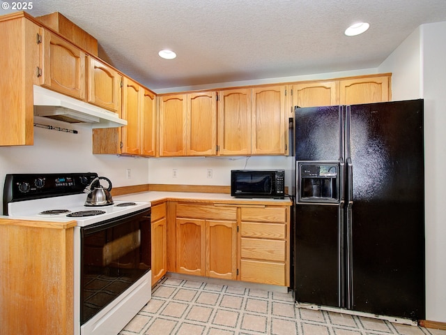 1313 NE 17th Ave, Battle Ground, WA 98604 - kitchen with black appliances, under cabinet range hood, light countertops, light floors, and a textured ceiling