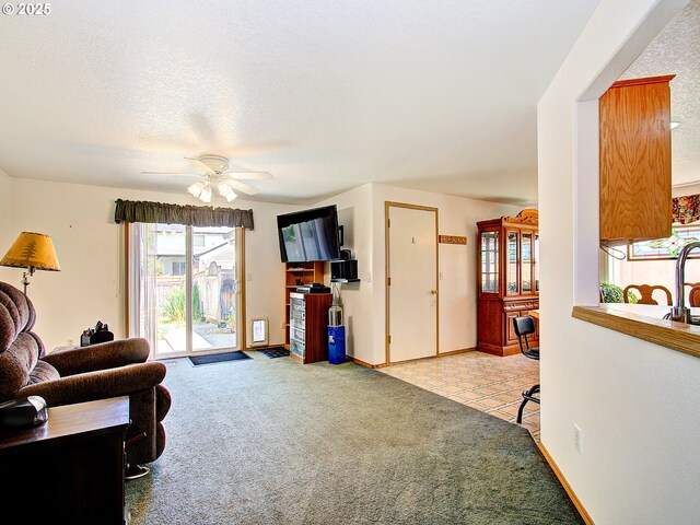 1313 NE 17th Ave, Battle Ground, WA 98604 - carpeted living area with ceiling fan and baseboards