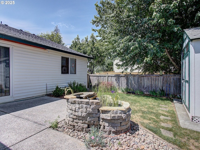 1313 NE 17th Ave, Battle Ground, WA 98604 - fenced backyard featuring an outdoor fire pit and a patio area