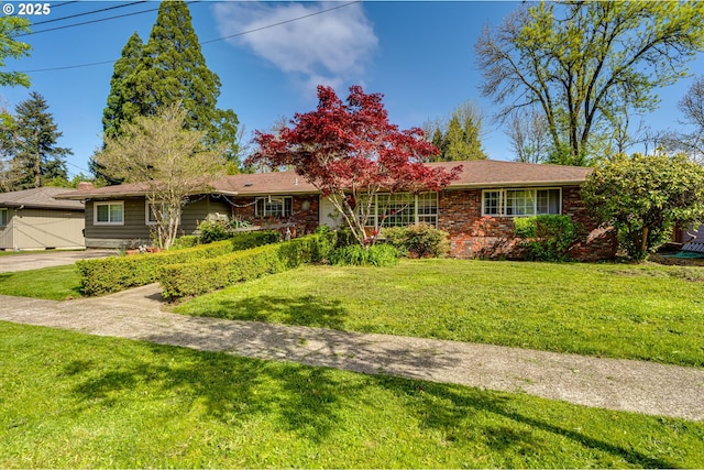 single story home featuring a front yard and brick siding