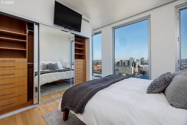 bedroom featuring light wood-type flooring