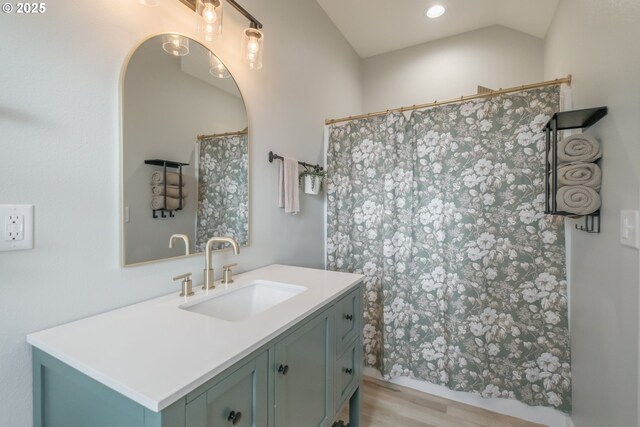 bathroom with wood finished floors, vanity, recessed lighting, and a shower with shower curtain