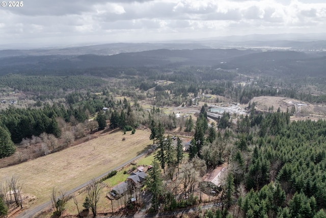 aerial view with a forest view and a mountain view