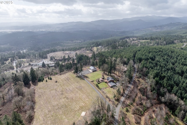 bird's eye view featuring a mountain view and a wooded view