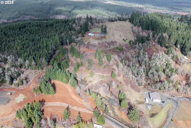 aerial view featuring a wooded view