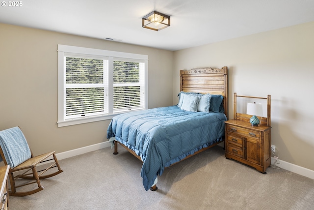 bedroom with carpet and baseboards