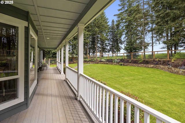 wooden terrace with a porch